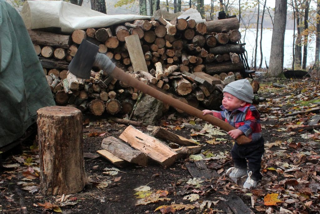 A photo of baby with an ax 