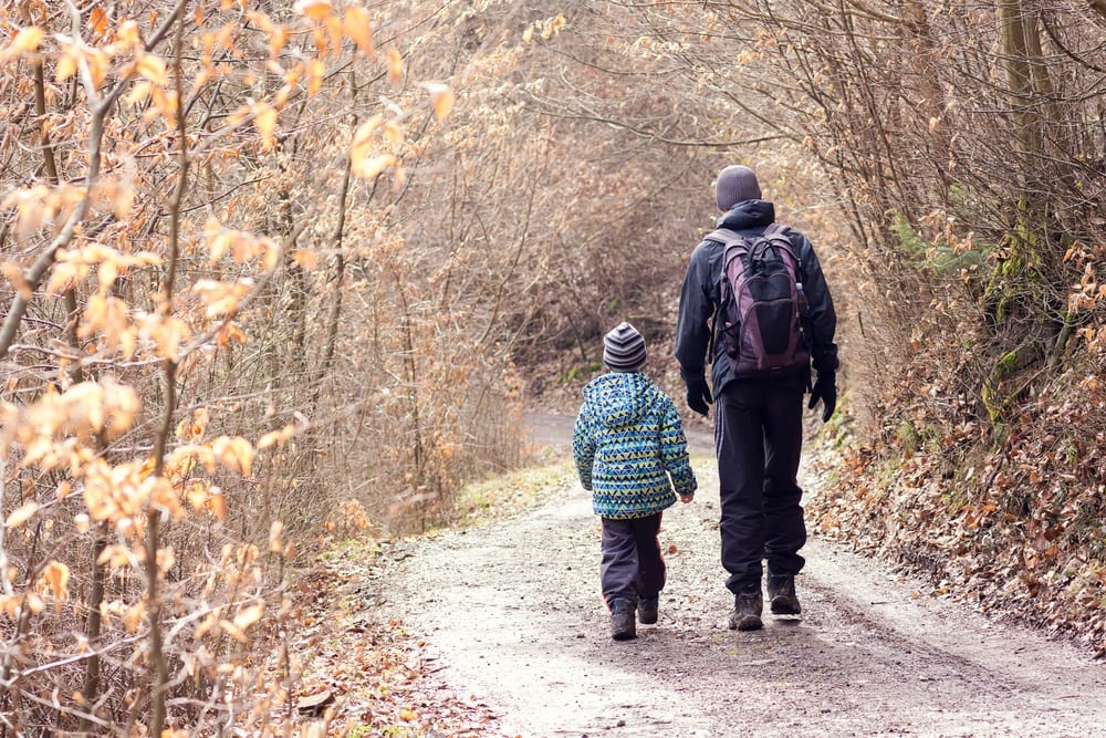 Father & son taking a walk in the winter 