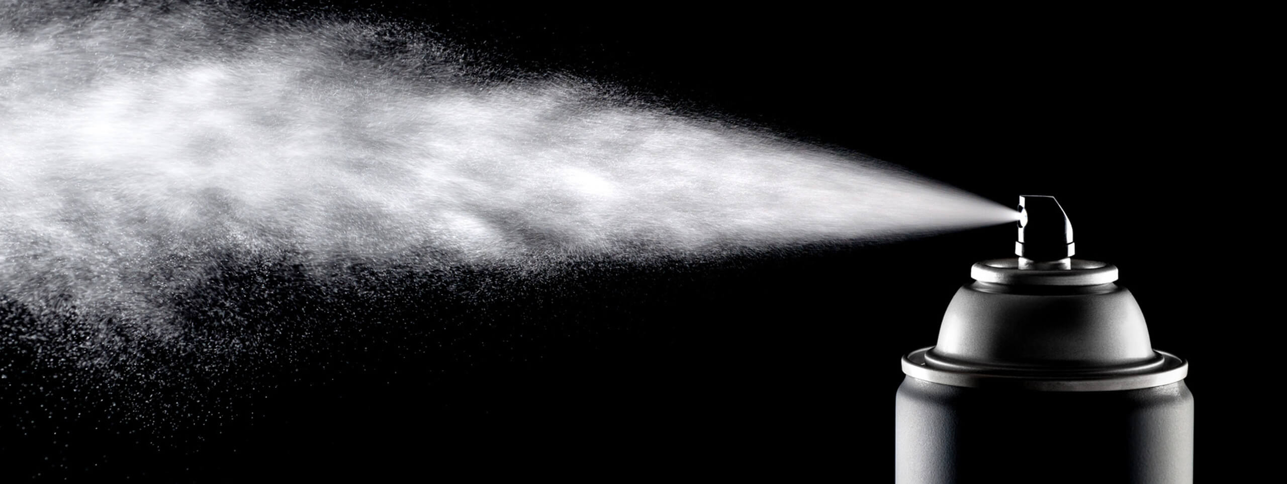 A can of hairspray being sprayed