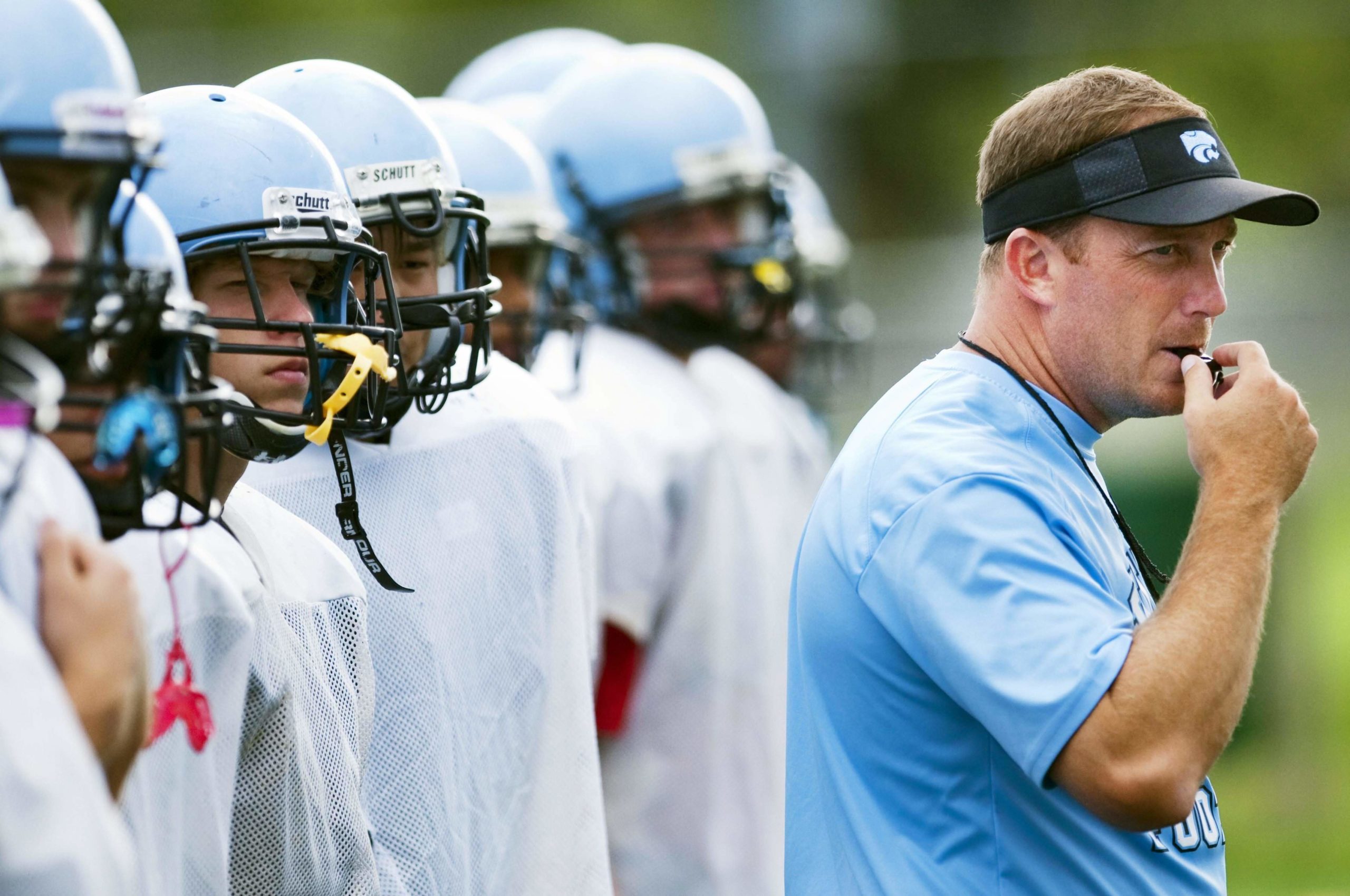 Football referee giving start to practice