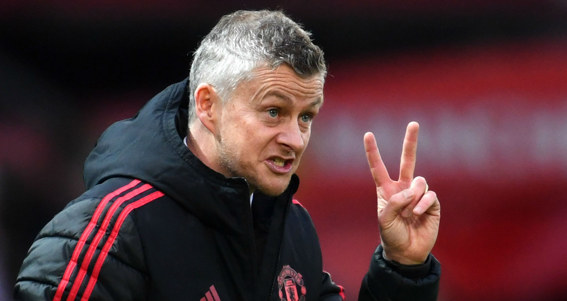 Ole Gunnar Solksjaer giving tactical instructions to his players during a game