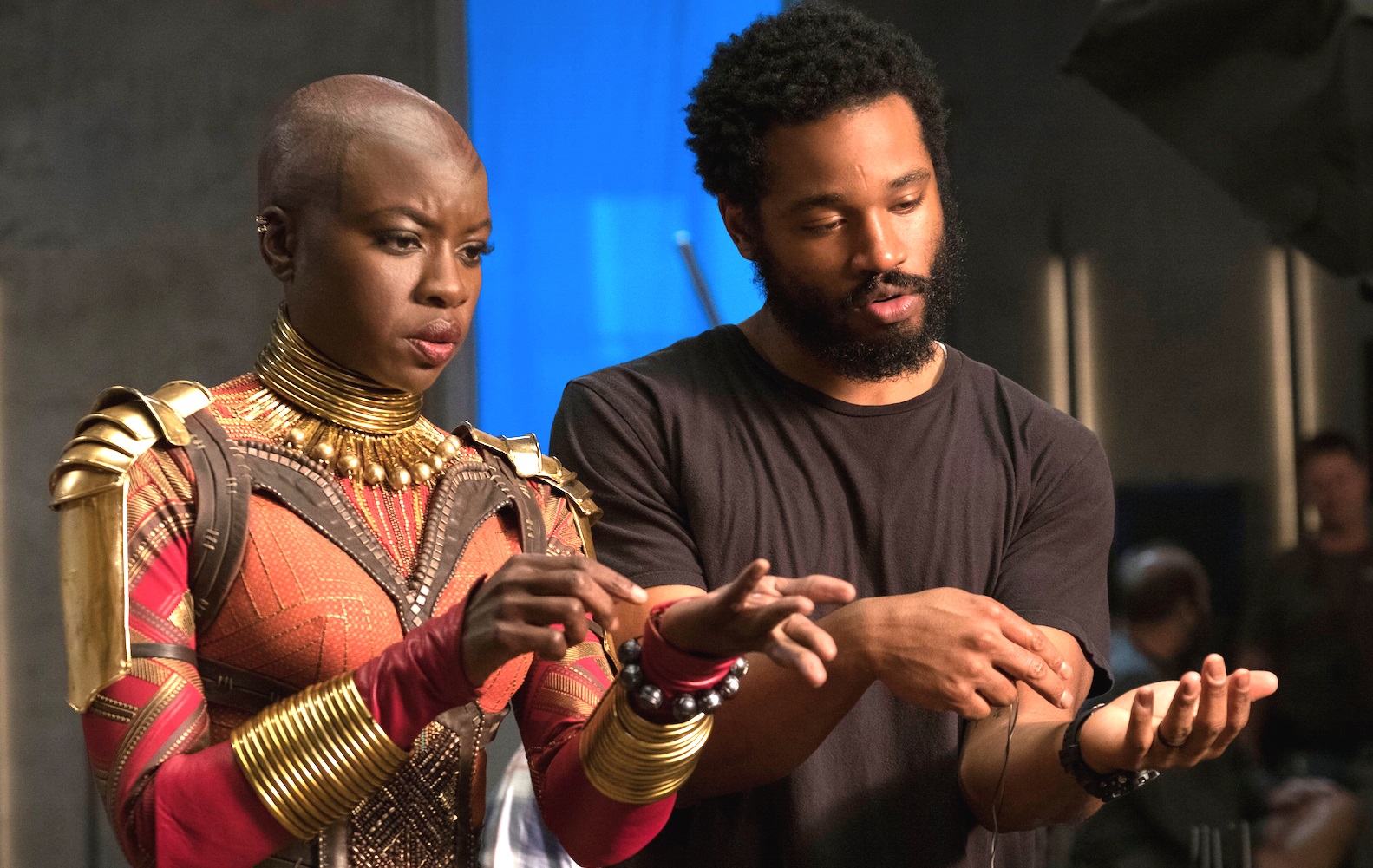 Ryan Coogler on the set of Black Panther with Lupita Nyong'o's character Nakia