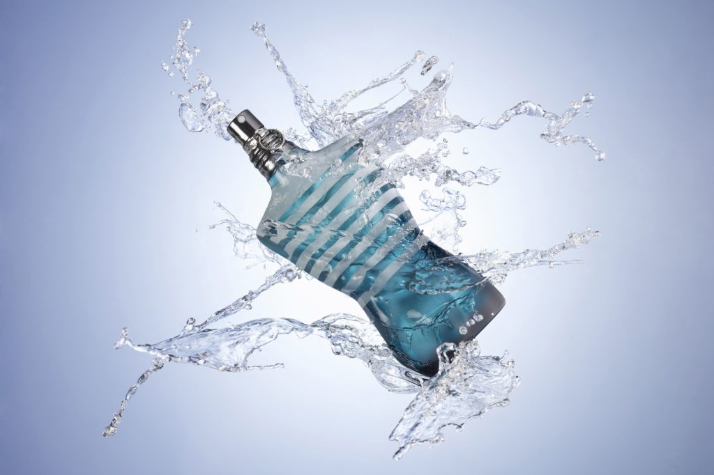 An aquatic cologne splashed with water