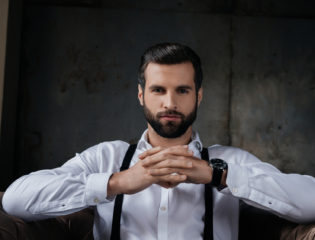 A well groomed man looking at the camera