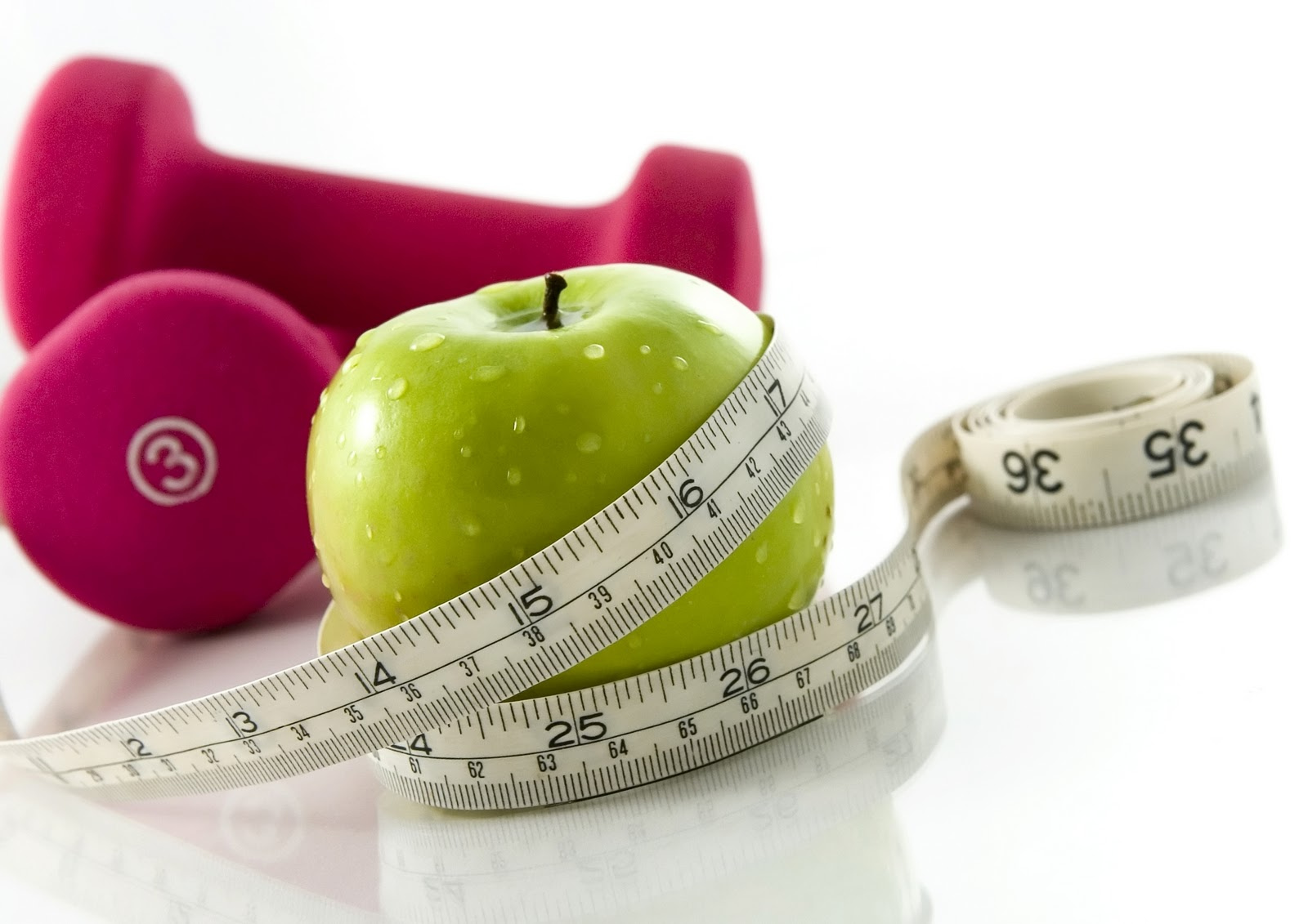 An apple, weights, and a measuring string