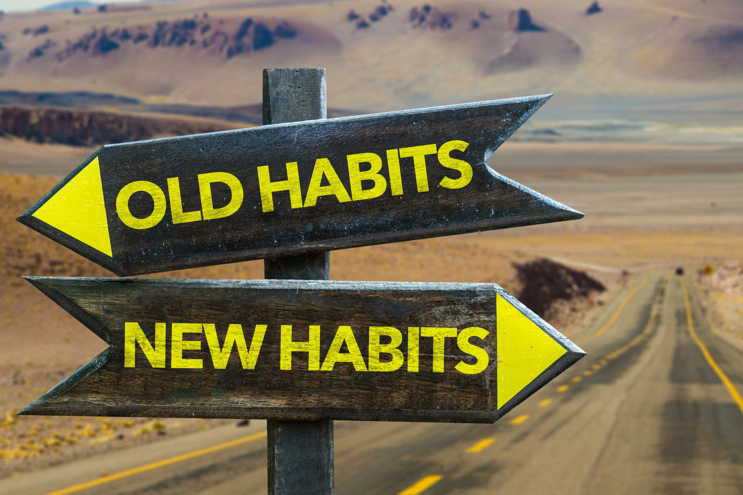 two road signs: Old Habits and New Habits