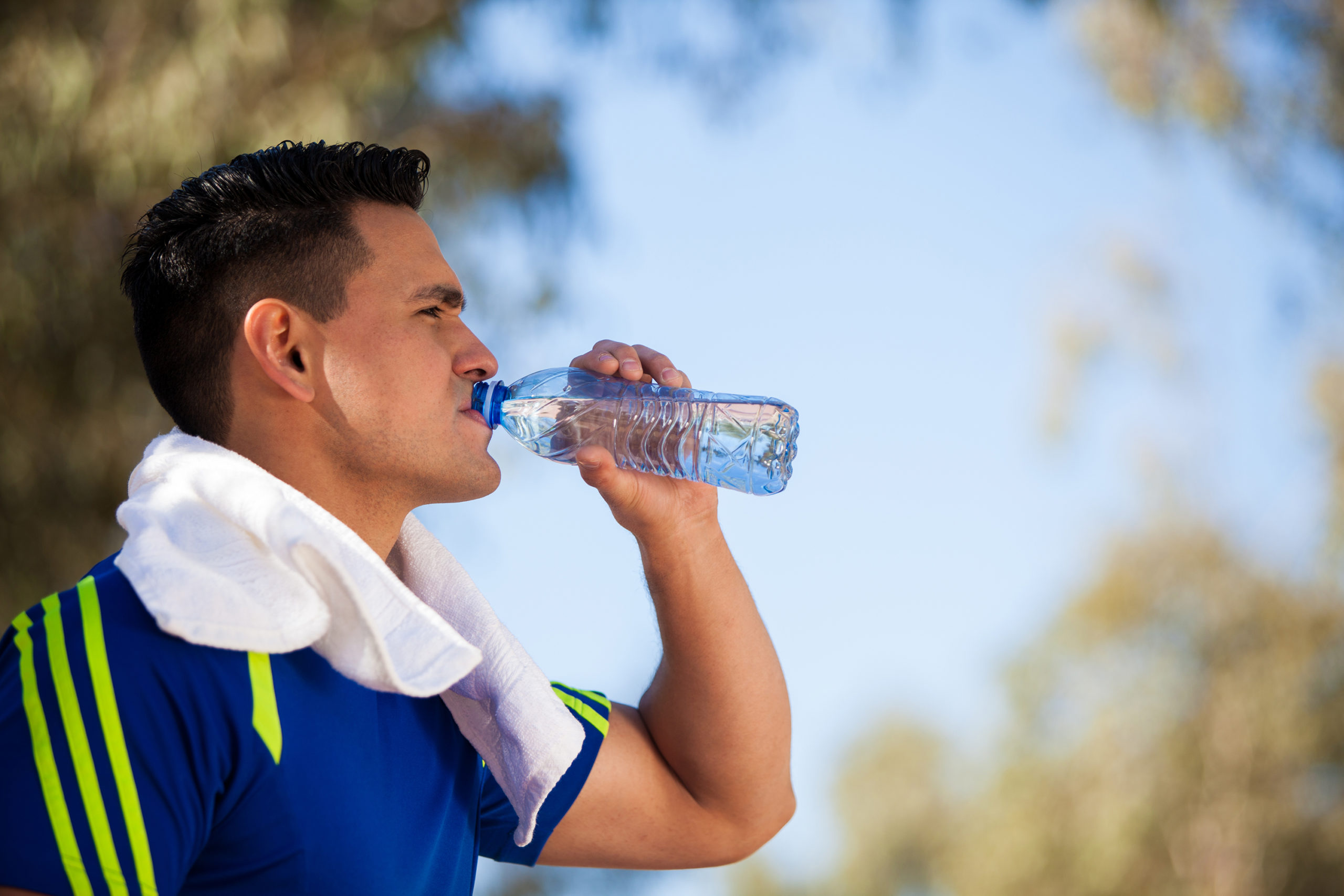 young man drinking water