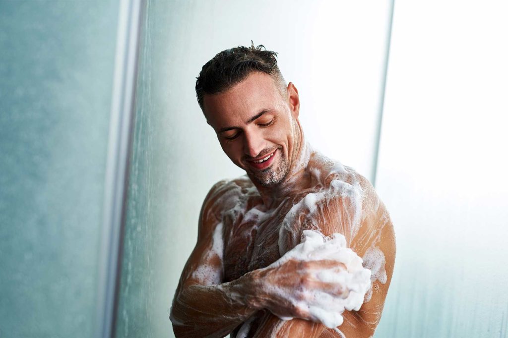 guy using a body wash